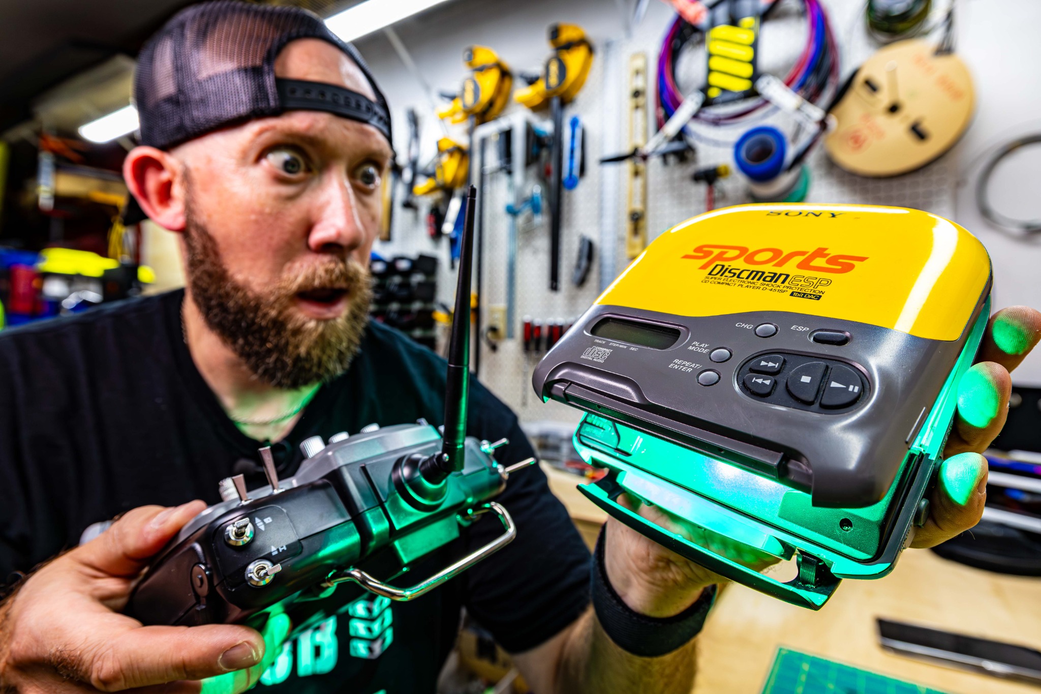 Craig in the workshop with a glowing modified CD player prop
